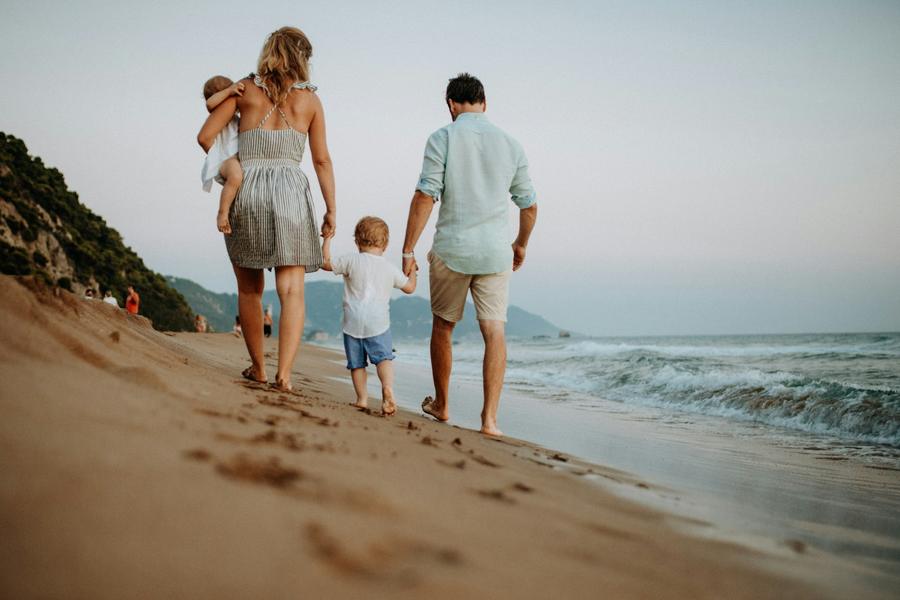 A family on the beach at dusk